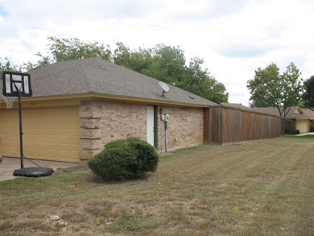 view of home's exterior with a lawn and a garage