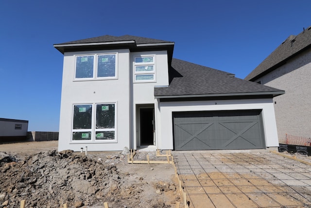 view of front of property with a garage