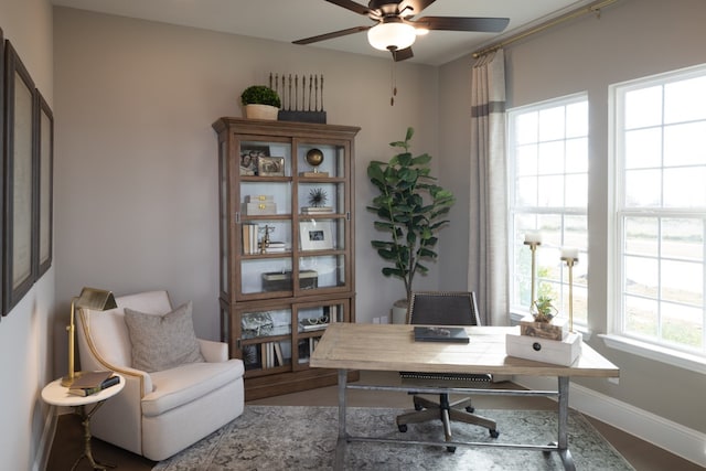 home office featuring hardwood / wood-style floors, ceiling fan, and a wealth of natural light