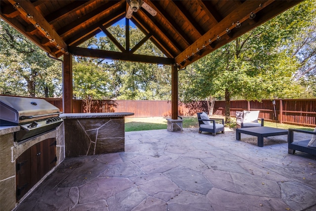 view of patio / terrace with a gazebo, grilling area, and exterior kitchen