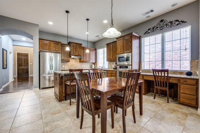 dining room featuring built in desk