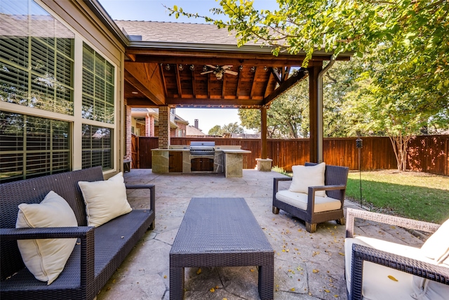 view of patio with a gazebo, ceiling fan, area for grilling, and an outdoor hangout area