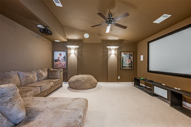 carpeted cinema featuring lofted ceiling and ceiling fan