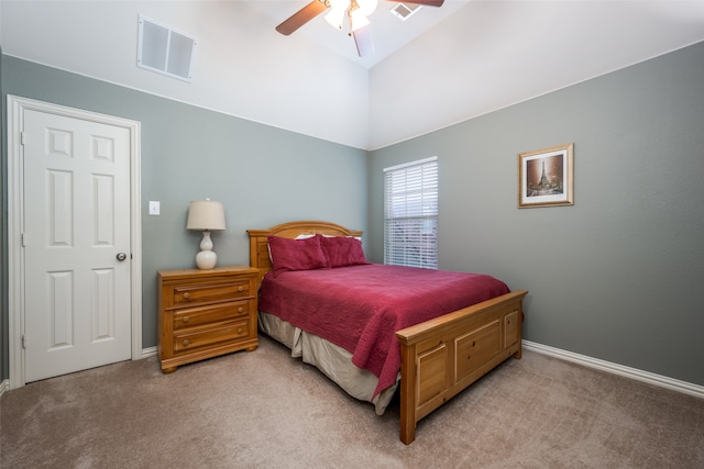 carpeted bedroom featuring high vaulted ceiling and ceiling fan