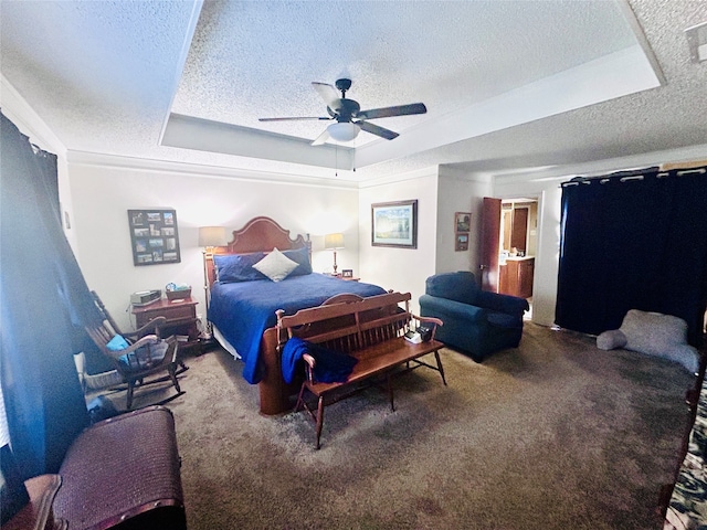 carpeted bedroom featuring a raised ceiling, a textured ceiling, and ceiling fan