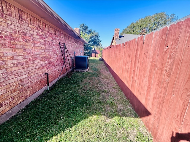 view of yard featuring central AC unit