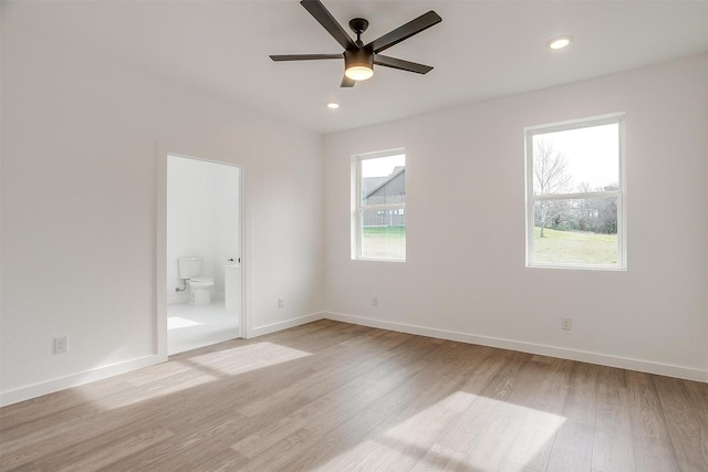 unfurnished bedroom featuring light wood-type flooring, ceiling fan, and ensuite bathroom