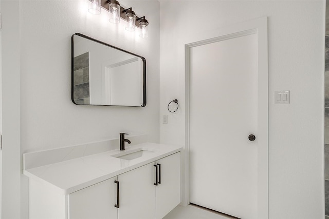 bathroom with vanity and tile patterned flooring