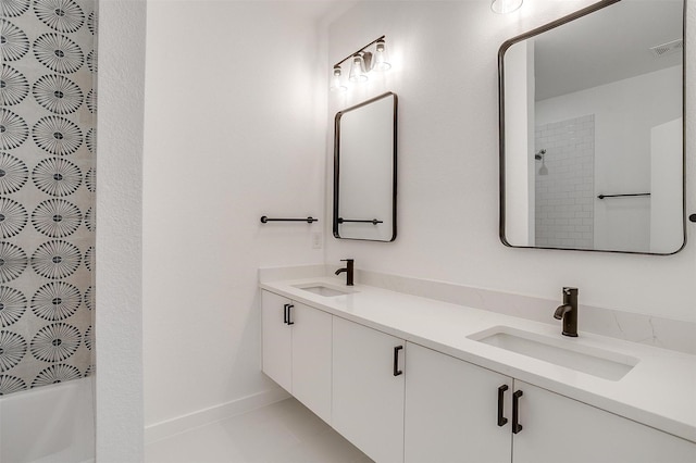 bathroom featuring tile patterned floors, vanity, and shower / bathing tub combination