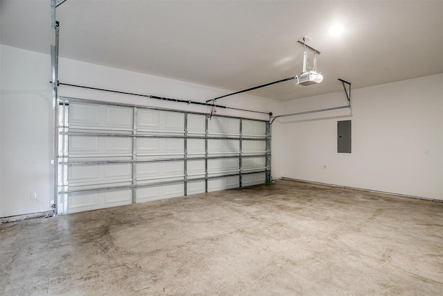 garage featuring electric panel and a garage door opener