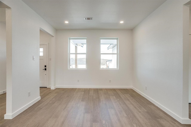 unfurnished room featuring light hardwood / wood-style flooring