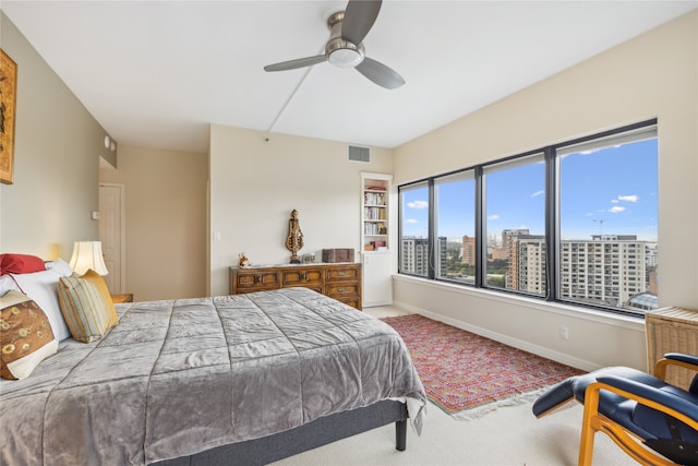 bedroom featuring ceiling fan and carpet flooring