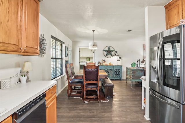 kitchen with dark wood-style flooring, visible vents, dishwasher, and stainless steel fridge with ice dispenser