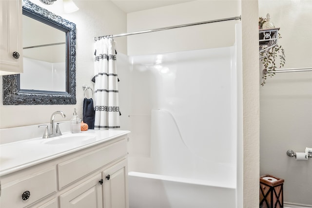 full bath featuring shower / tub combo and vanity