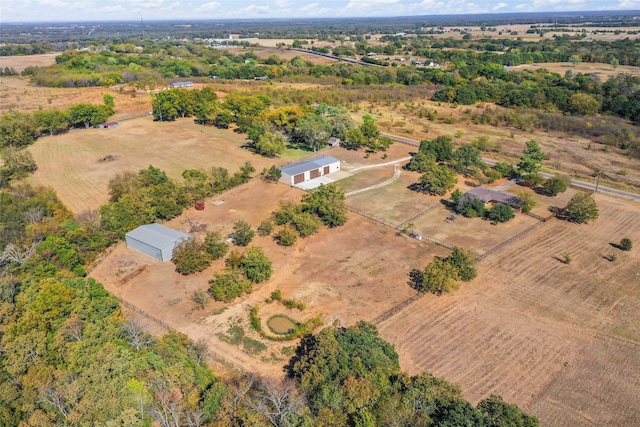 birds eye view of property featuring a rural view