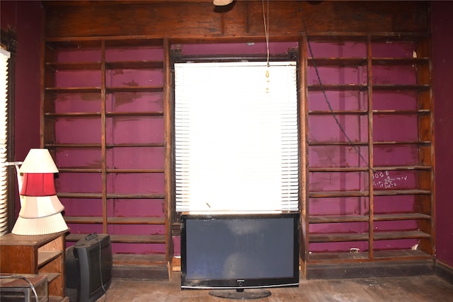 miscellaneous room featuring dark wood-type flooring