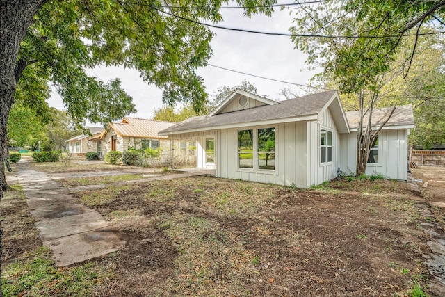 rear view of house featuring a carport