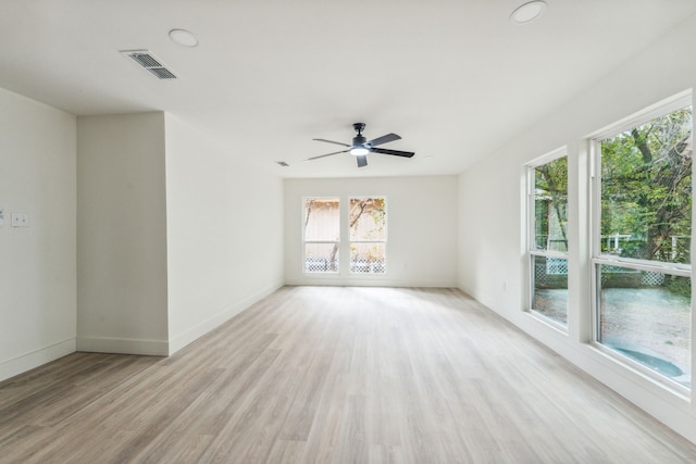 empty room with ceiling fan and light wood-type flooring