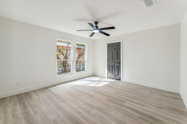 spare room featuring ceiling fan and light wood-type flooring