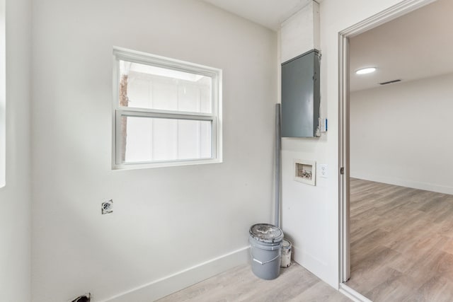 laundry area featuring light hardwood / wood-style flooring, washer hookup, and hookup for an electric dryer