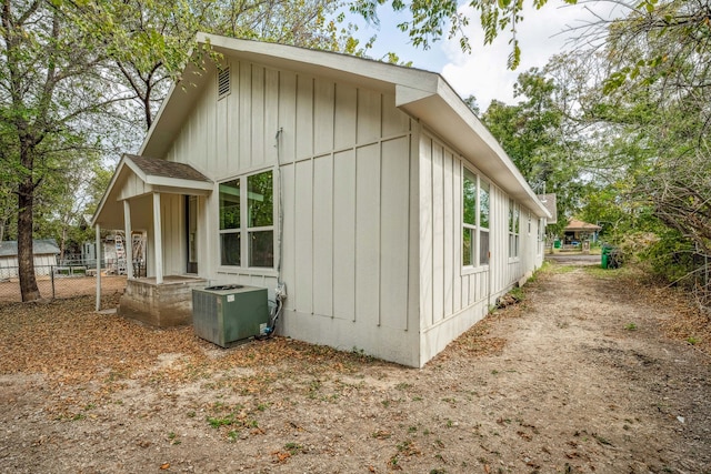 view of side of property with cooling unit