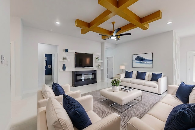 tiled living room with coffered ceiling, ceiling fan, and beamed ceiling