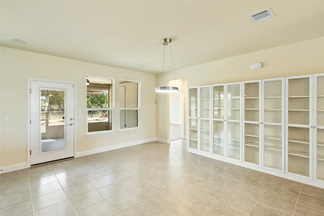 spare room with light tile patterned floors