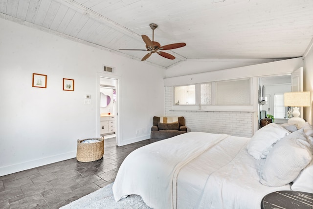 bedroom with ensuite bath, wooden ceiling, vaulted ceiling, and ceiling fan