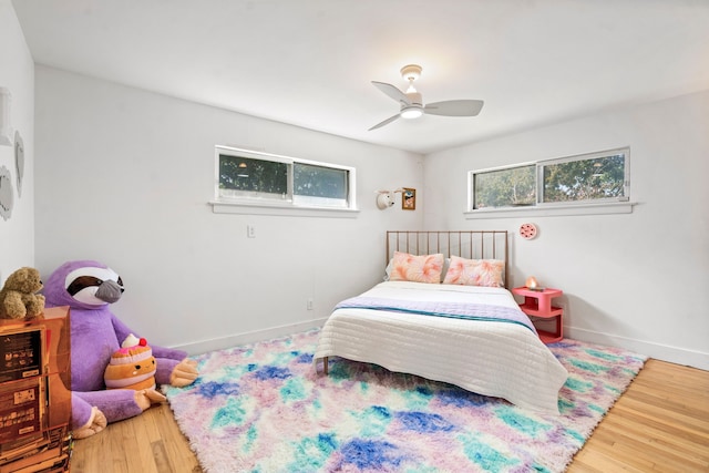 bedroom with hardwood / wood-style flooring and ceiling fan