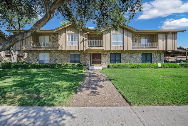 view of property with a front lawn