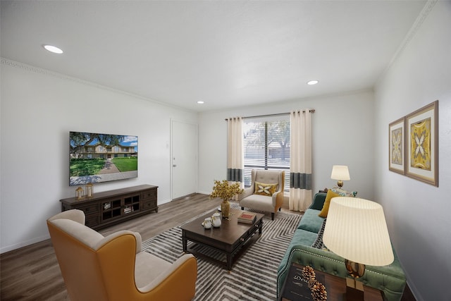 living room featuring ornamental molding and hardwood / wood-style flooring