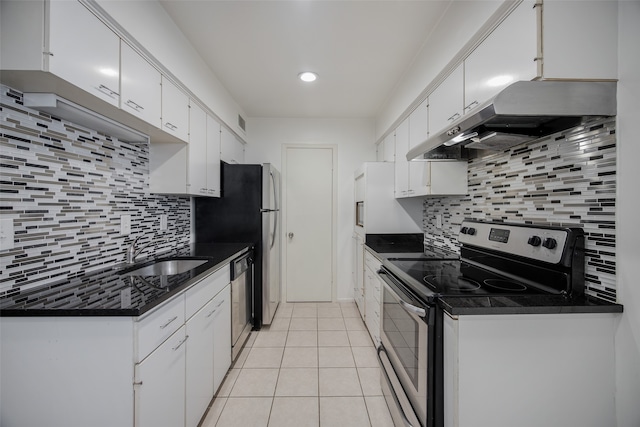 kitchen with white cabinets, sink, range hood, tasteful backsplash, and stainless steel appliances