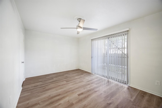 empty room featuring ceiling fan and light wood-type flooring