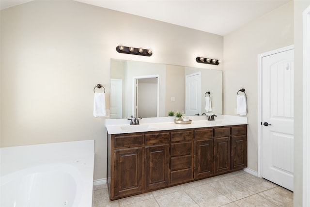 bathroom featuring a bath, tile patterned flooring, and vanity