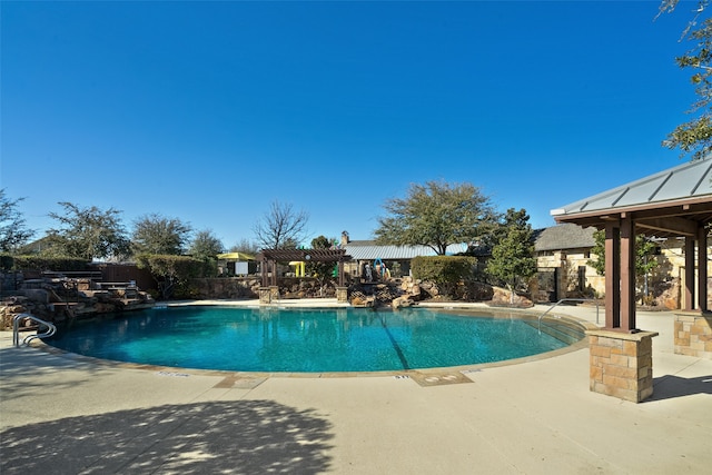 view of pool featuring a patio