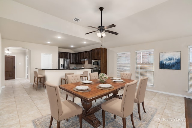 dining area featuring light tile patterned floors and ceiling fan