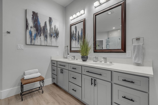 bathroom featuring vanity, hardwood / wood-style floors, and an enclosed shower