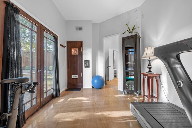 foyer featuring french doors and light hardwood / wood-style flooring