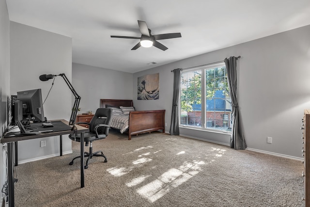 bedroom with ceiling fan and carpet floors