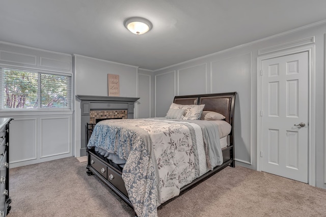 bedroom featuring crown molding and light colored carpet