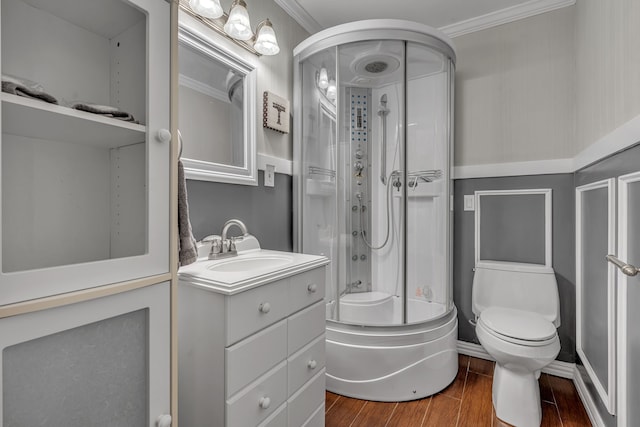 full bathroom featuring bath / shower combo with glass door, wood-type flooring, toilet, ornamental molding, and vanity