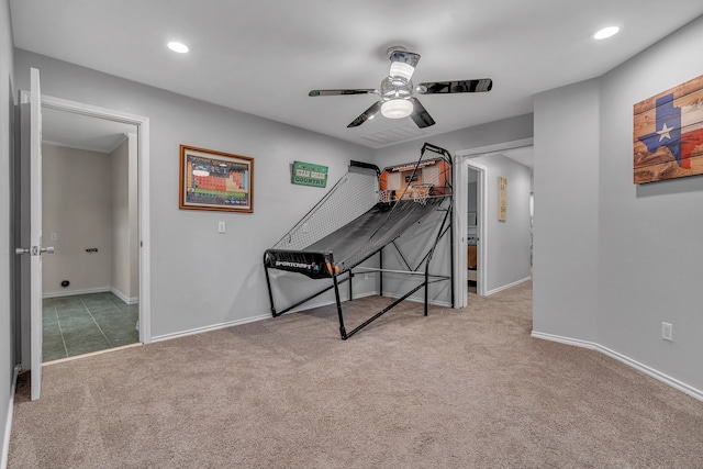 playroom featuring light colored carpet and ceiling fan