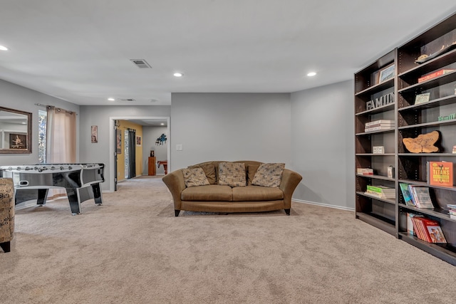 living area featuring light colored carpet