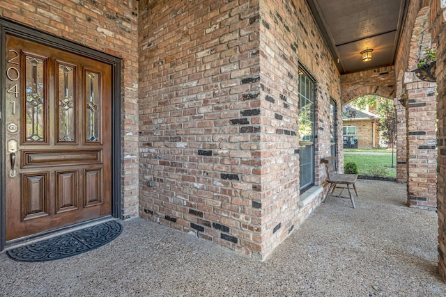 doorway to property featuring covered porch