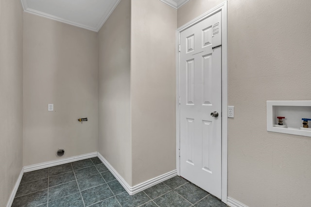 laundry area with dark tile patterned floors, ornamental molding, hookup for an electric dryer, and washer hookup