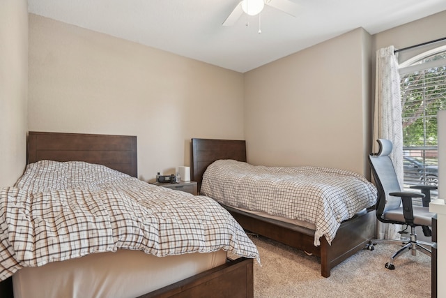 bedroom with light colored carpet and ceiling fan