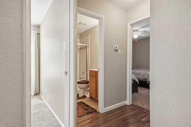 hallway with dark hardwood / wood-style floors