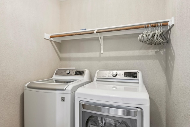 812 Redbud Rd, Burleson, TX 76028 - washroom with independent washer and dryer and a textured wall