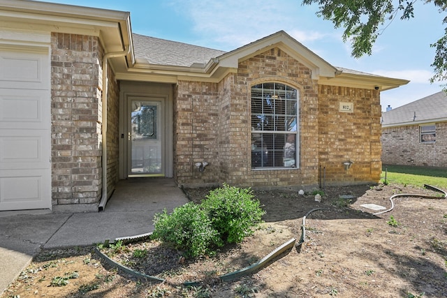 doorway to property featuring a garage