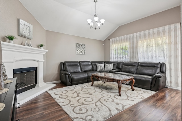 living room with vaulted ceiling, a notable chandelier, and dark hardwood / wood-style flooring